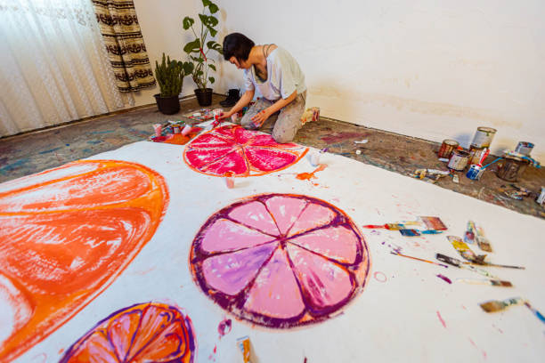 istock Female artist making art in the studio 1388629422