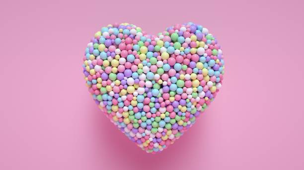 istock Heart Shaped Colorful Balls On Pink - 3D Illustration 1388631873