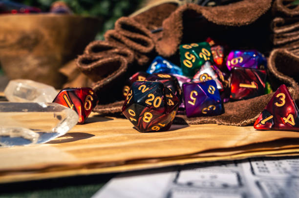 close-up of RPG dice spilling out of a dice bag stock photo