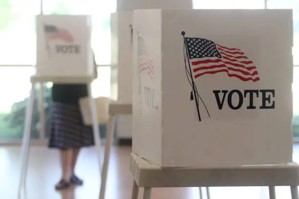 Voting booths stand ready for use in a U.S. election.