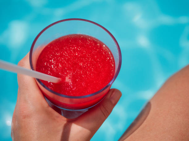 istock Glass with a refresh strawberry smoothie and a pretty woman 1388634209