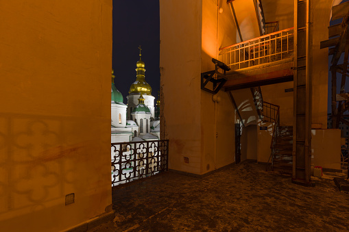 The bell tower of St. Sophia Cathedral and the view of its domes in the evening, Kiev, Ukraine