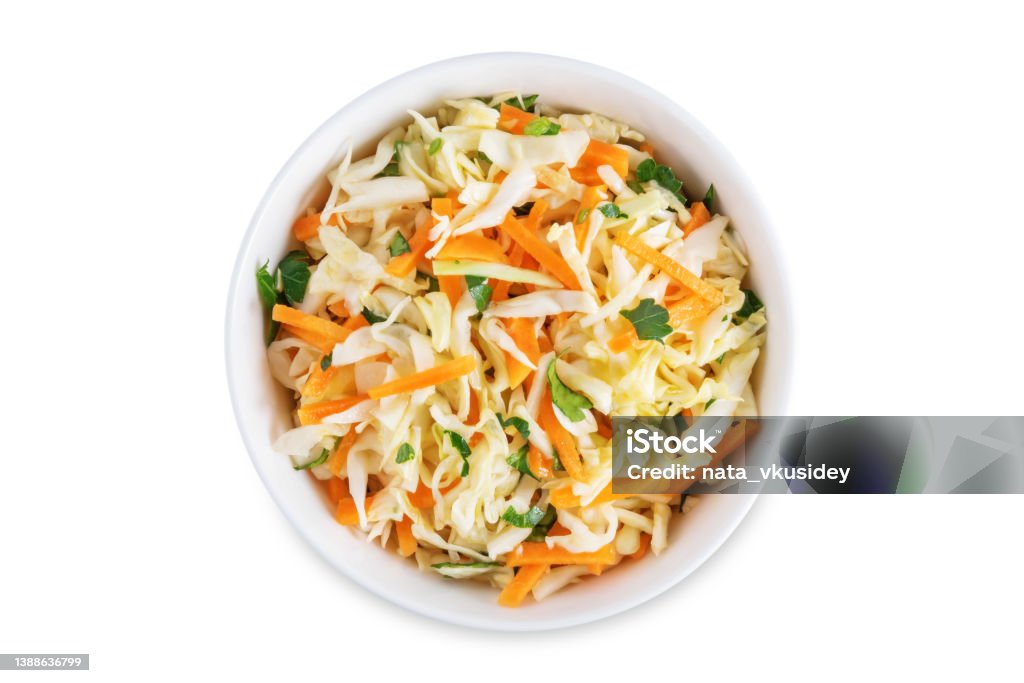Cabbage carrot salad in a bowl on a white isolated background Cabbage carrot salad in a bowl on a white isolated background. toning. selective focus Coleslaw Stock Photo
