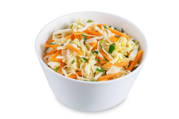 istock Cabbage carrot salad in a bowl on a white isolated background 1388636813