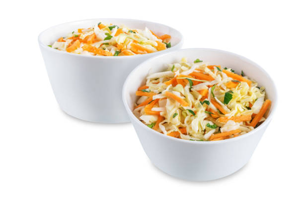 istock Cabbage carrot salad in a bowl on a white isolated background 1388636815