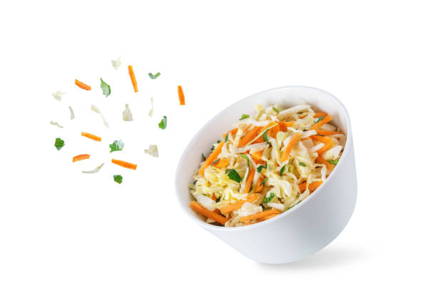 istock Cabbage carrot salad in a bowl on a white isolated background 1388636820