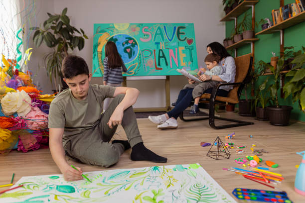 istock Kids drawing with their mother 1388636979
