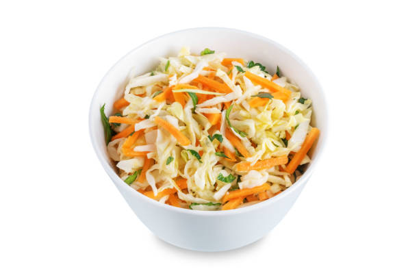 istock Cabbage carrot salad in a bowl on a white isolated background 1388637425
