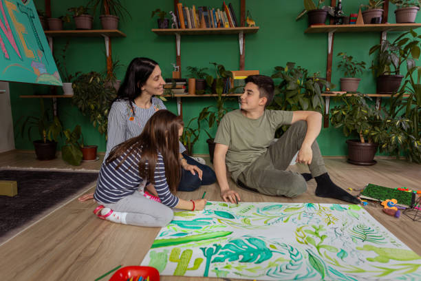 istock Happy family doing homework for school 1388637542