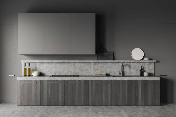 istock Grey Modern design kitchen interior with empty room area, concrete flooring. dark door on left. Cooking area concept. 3d rendering 1388638404