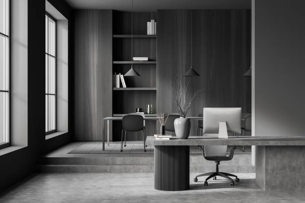 istock Grey office room interior with workplace, chairs and table, shelf near window 1388638952
