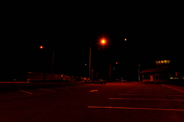 dark late night expressway truck stop rest area parking lot - street light parking lot night lot imagens e fotografias de stock