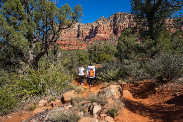 istock Girls on spring hiking trip in red mountains. 1388641762