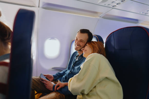 istock Couple traveling by plane 1388641775