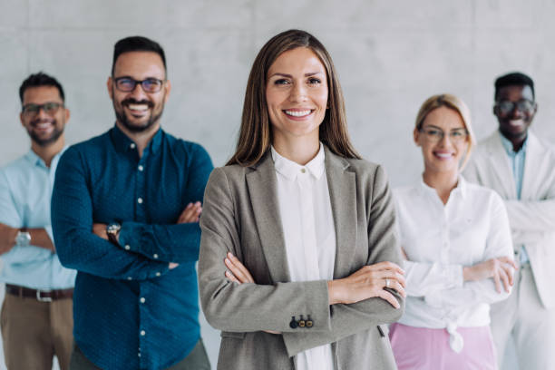 istock Confident businesswoman and her team. 1388642680