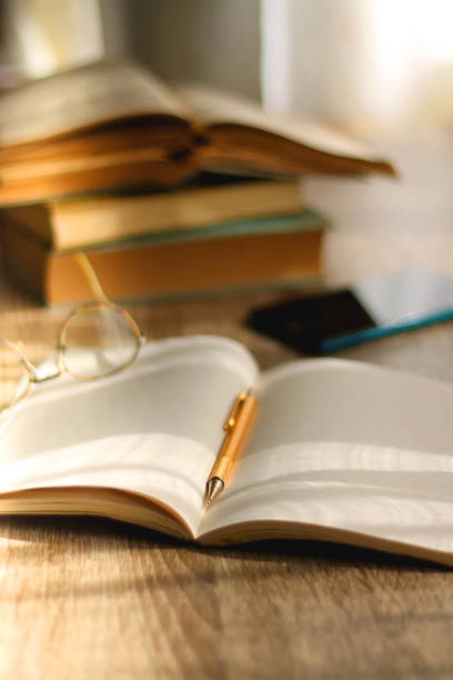 istock Notebook, Pencil, Glasses, Phone and Books 1388642954