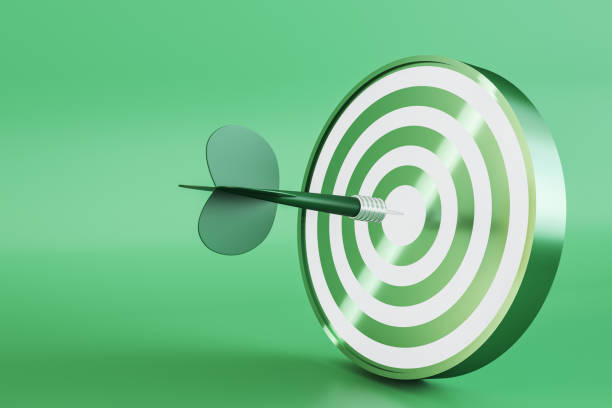 istock Creative bullseye target with arrow on green background with mock up place. Targeting and marketing concept. 3D Rendering. 1388643003