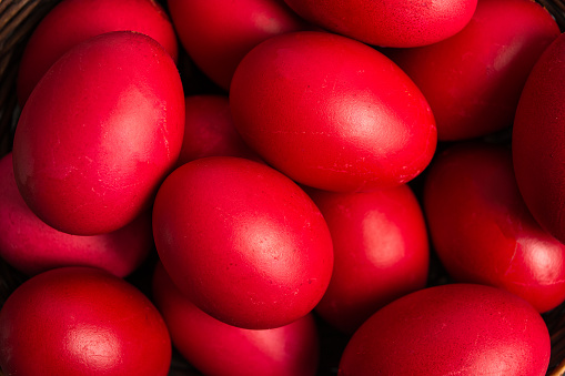 Easter eggs. Red Easter eggs on a red background flat lay top view. Holiday concept.