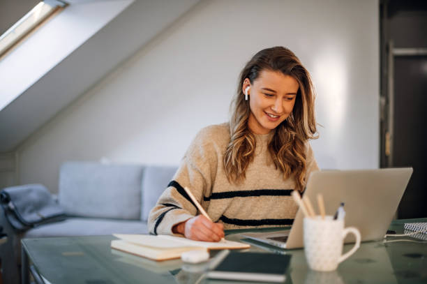 istock Woman working from a home on her a laptop 1388643813
