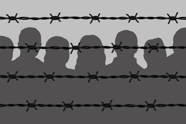 dunkle menschensilhouetten hinter stacheldrahtzäunen - barbed wire wire war prison stock-grafiken, -clipart, -cartoons und -symbole