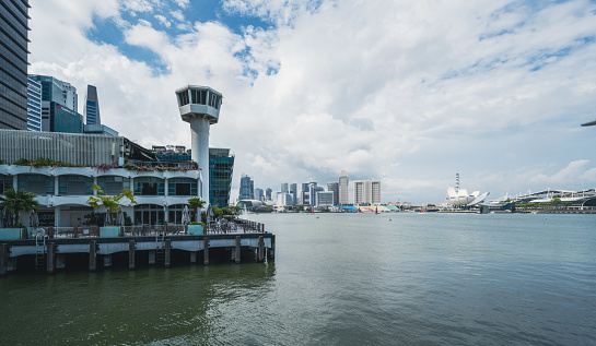 A lighthouse at Fullerton Bay in Singapore opposite side of the Singapore River. Seen a cloudy day in the summer.