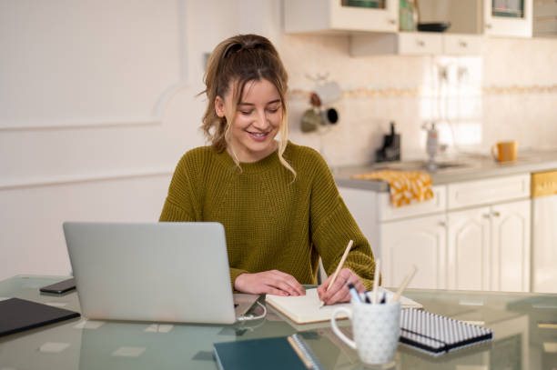 istock Woman working from a home on her a laptop 1388644089