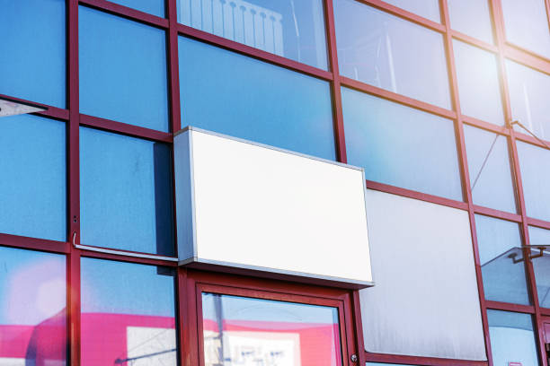 istock Information board with blank space for mockup mounted on glass facade 1388644154