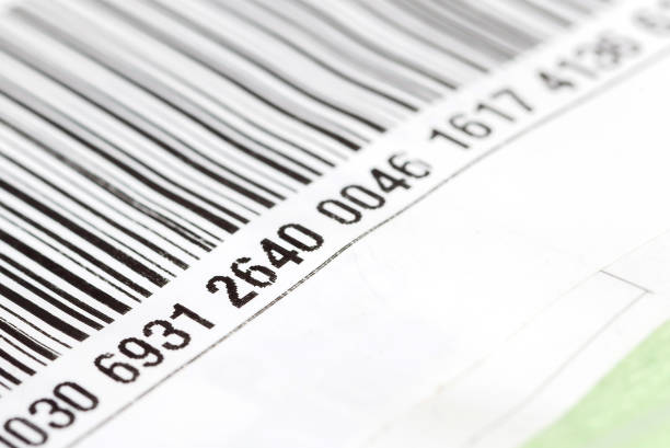 Part of a barcode label, numbers on a product package, object detail, macro, extreme closeup, nobody, shallow dof. Retail, product origin, number, indentification, commerce, economy, business concept parte de una etiqueta de código de barras, números en un paquete de producto, detalle del objeto, macro, primer plano extremo, nadie, dof poco profundo. venta al por menor, origen del producto, número, identificación, comercio, economía, concepto de n