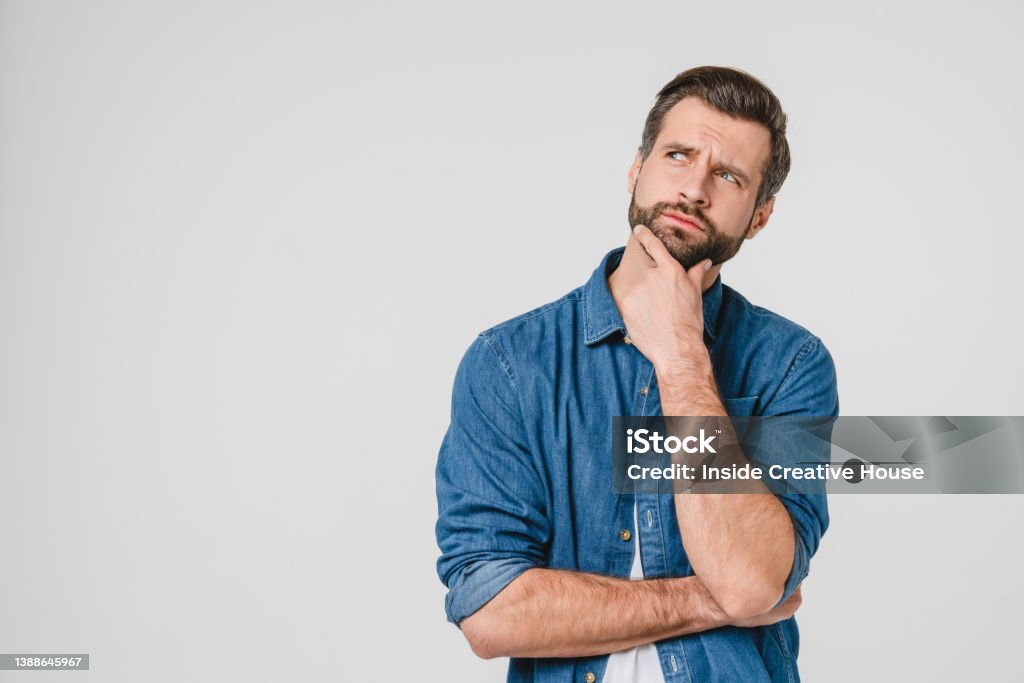 Pensive thoughtful contemplating caucasian young man thinking about future, planning new startup looking upwards isolated in white background Contemplation Stock Photo