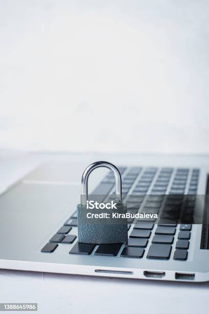 Concept Of Internet Data Protection Security System Using Laptop Safety Development Of Reliable Online Protection System Laptop And Padlock With Keys On The Table Network Hacking Protection Stock Photo - Download Image Now