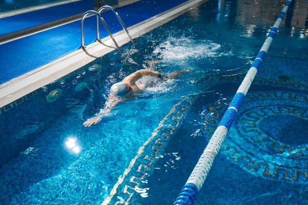 istock Sporty male swimming in pool during workout 1388647253