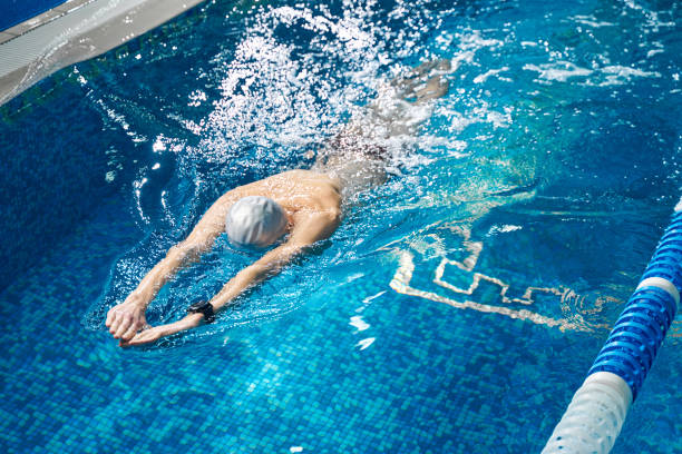 istock Active training of sporty man in the pool 1388647266