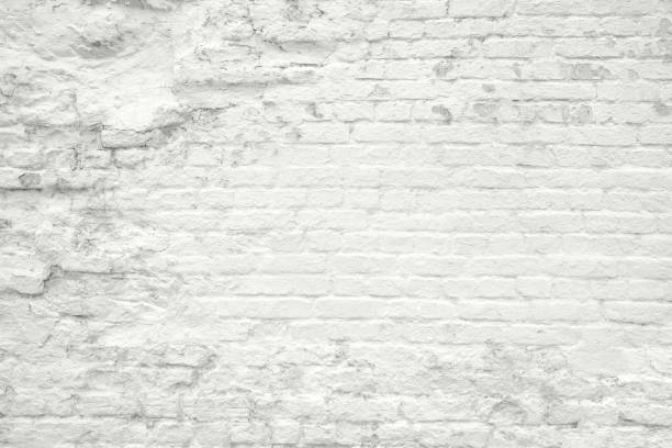 istock Old white gray brick grunge wall texture background 1388647360