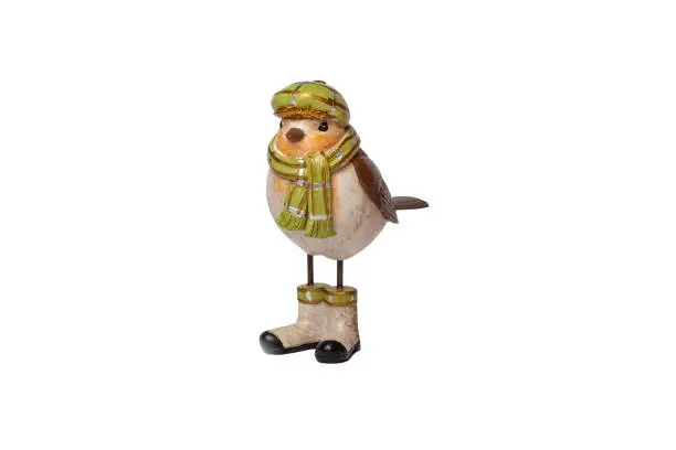 Photo of Ceramic sparrow in clothes on a white isolated background