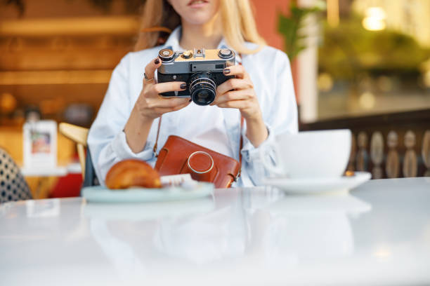 istock Pretty young woman having lunch in restaurant 1388650220