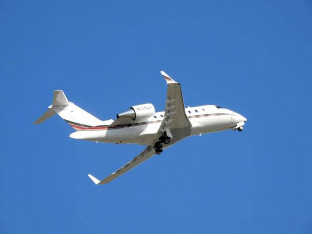 Boca Raton, Palm Beach County, Florida, USA. March 28, 2022. A Bombardier fixed wing multi engine (22 seats / 2 engines) taking off from the Boca Raton Airport. N245QS