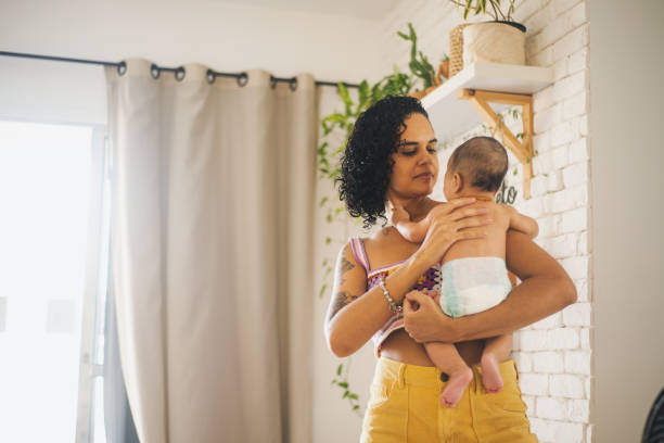 istock Mother with baby boy on her lap. 1388653057