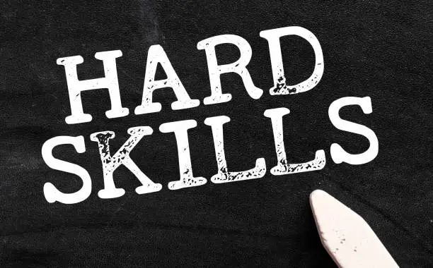 Photo of HARD SKILLS words on a black chalk board.