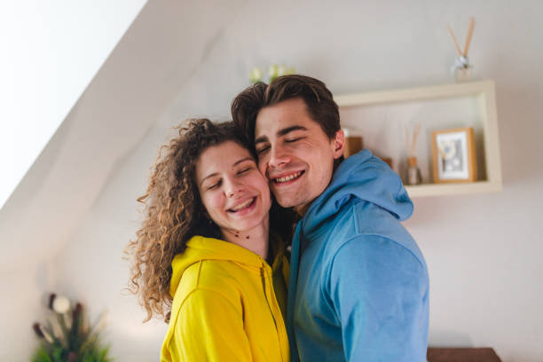 istock Close-up of a young couple being close together while smiling 1388653372