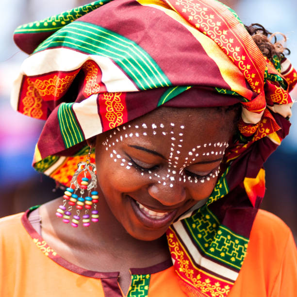 African Traditional Woman Maputo, Mozambique - October 19, 2011. A dancer in traditional clothes at a public opening ceremony of the Statue of Samora Machel, in Maputo. mozambique stock pictures, royalty-free photos & images