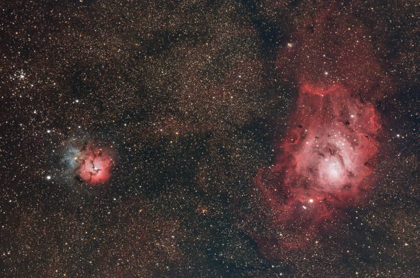istock Lagoon and Trifid Nebulas 1388656773
