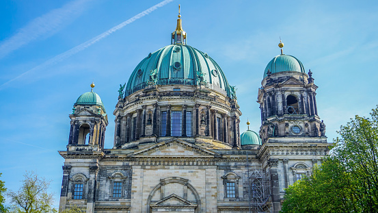 The stunning architecture of Berlin Cathedral, one of the greatest monuments of the German capital with beautiful shapes and decorative statues. World-famous landmarks.
