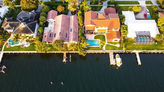 View from above of large residential houses in island small town Boca Grande on Gasparilla Island in southwest Florida. American dream homes as example of real estate development in US suburbs.