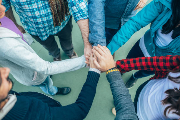 istock Friends with hands together 1388663033