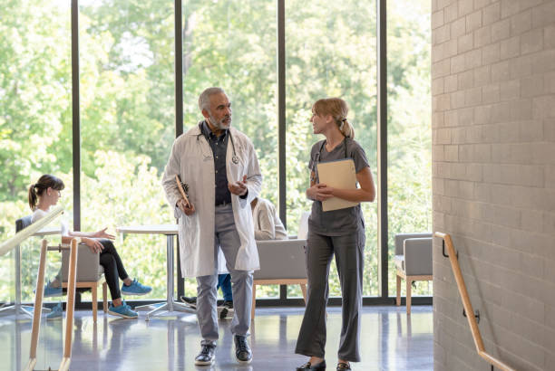 istock Doctor and Nurse Walking Together 1388665063