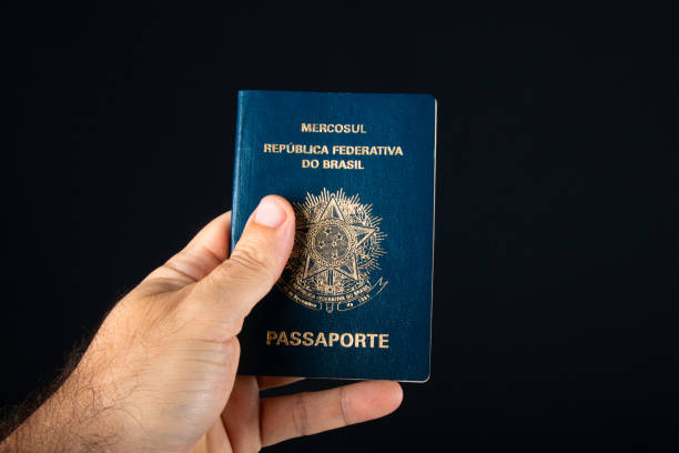 istock Hand holding Brazilian passport 1388671395