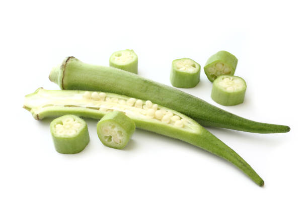 istock Raw green okra sliced on white background 1388673639