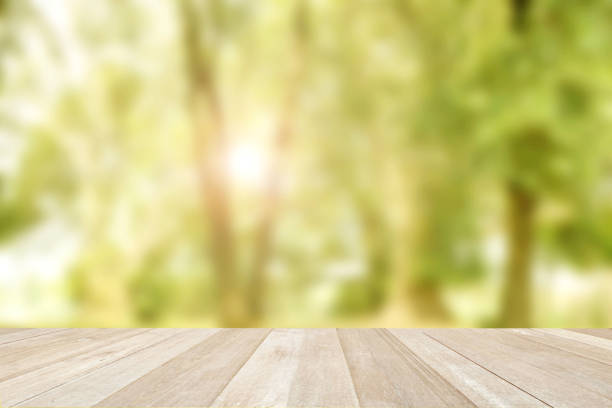 istock Empty top wooden table on soft focus blurred summer of nature background 1388681419