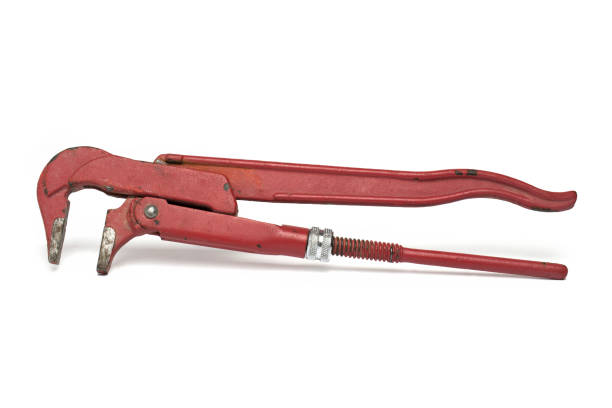 Old red pipe wrench  plumber tool  isolated on white background