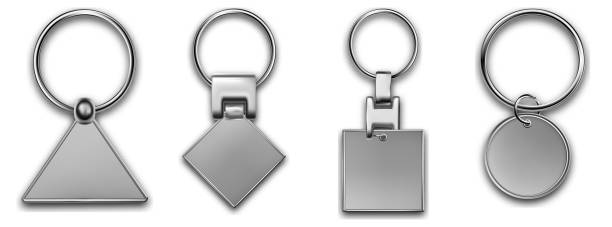 istock Metal keyring different forms, leather keychain, holder trinket for key with metal ring. Silver colored accessories. Realistic template metal keychain set. Blank accessory for corporate identity. 1388692292